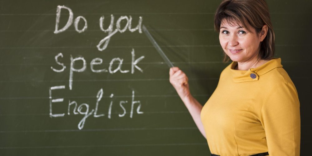 front-view-teacher-writing-chalkboard